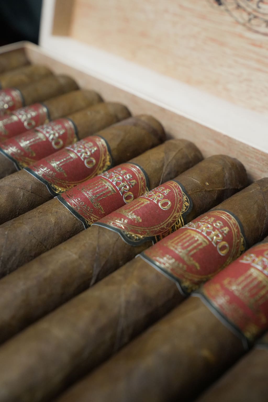 Casa Berro Red cigars in a wooden box, photographed in soft side light.